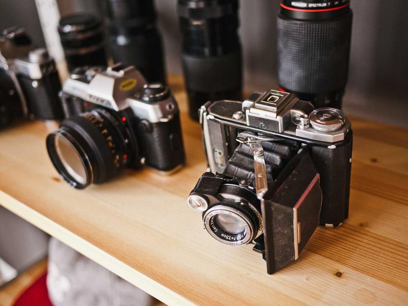 Law library interior with leather-bound legal reference books, wooden reading table with legal documents, warm lamp lighting, prestigious law firm atmosphere